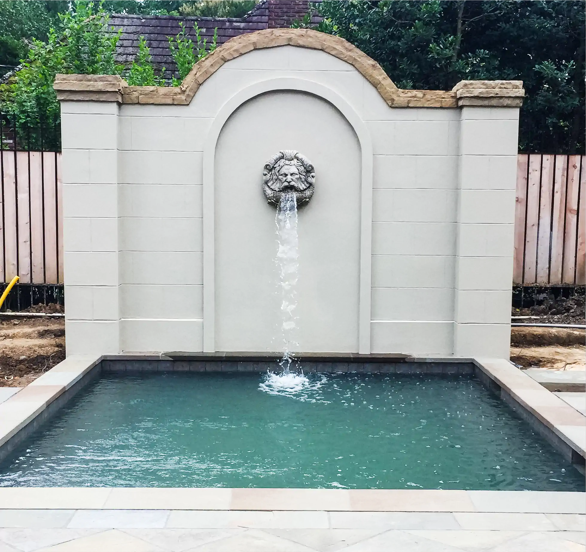 custom water fountain feature for your custom swimming pool in memphis, TN by ogden pools