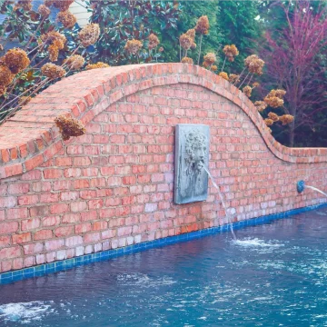 custom pool water spout features in memphis from ogden pools