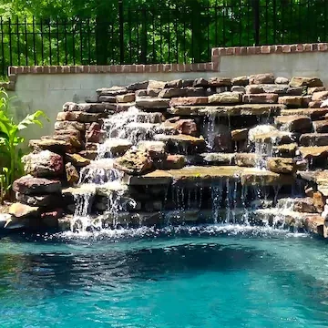 custom pool stacked stone water feature by ogden pools in Memphis, TN